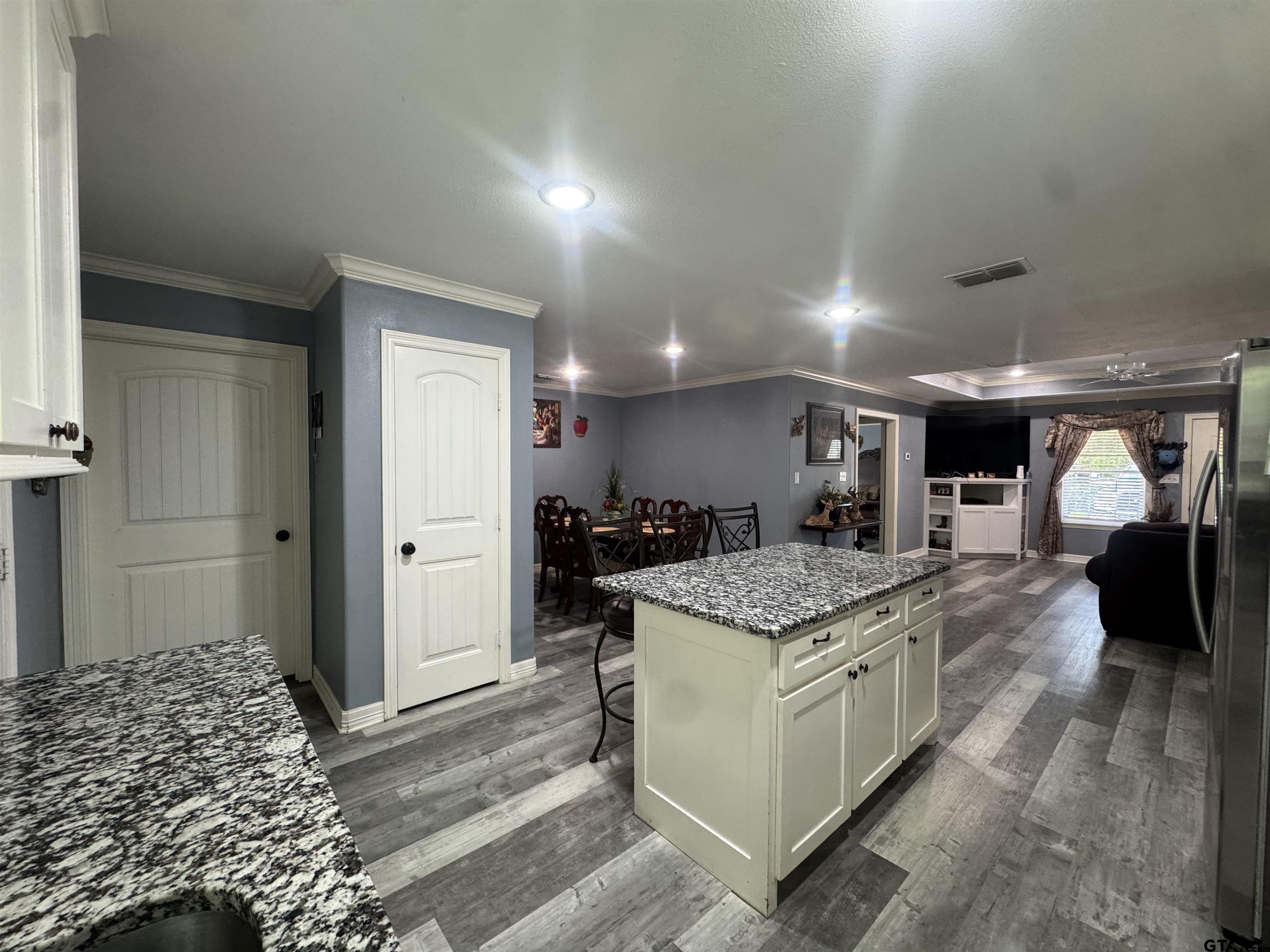 8261 County Road 381 Tyler, TX 75708 - Photo 5 of 24 a kitchen with stainless steel appliances granite countertop a stove oven and a refrigerator