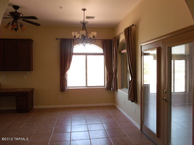 1490 Circulo Jacona Rio Rico, AZ 85648 - Photo 11 of 29 a view of hallway with windows and chandelier