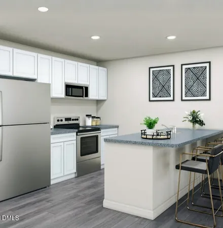 a kitchen with white cabinets and white appliances