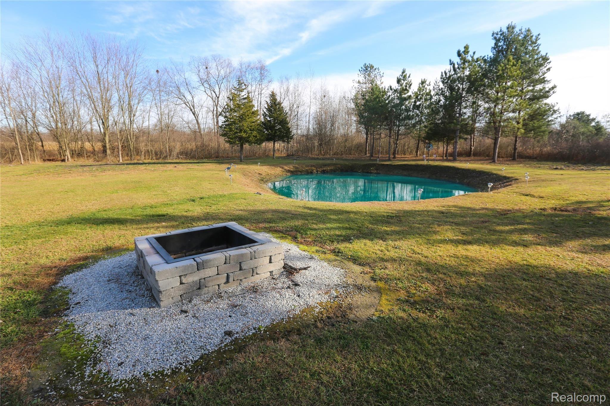 2120 East Vienna Road Clio, MI 48420 - Photo 32 of 37 Stocked Pond With Fountain, Firepit!