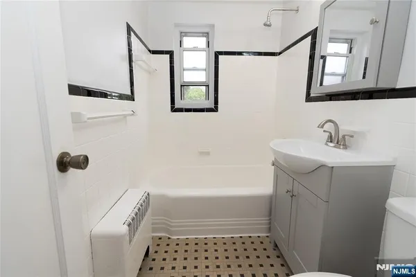 a bathroom with a sink and a bathtub