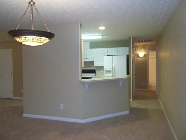 a view of a hallway with a chandelier