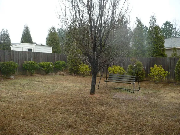 a view of a bench in a backyard