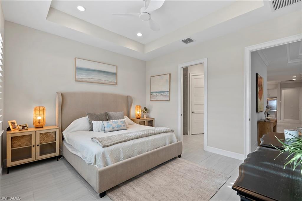 5716 Highbourne Drive Naples, FL 34113 - Photo 15 of 36 a bedroom with bed and a couch
