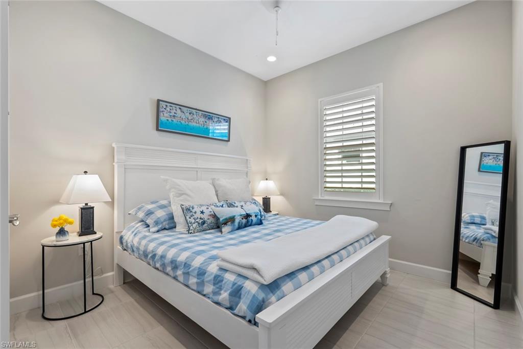 5716 Highbourne Drive Naples, FL 34113 - Photo 19 of 36 a bedroom with a bed and window
