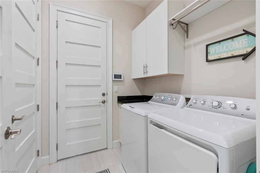 5716 Highbourne Drive Naples, FL 34113 - Photo 20 of 36 a utility room with dryer and washer