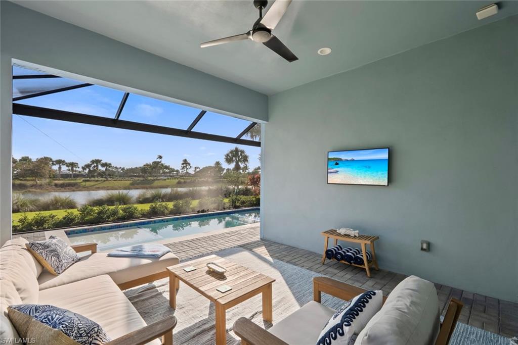 5716 Highbourne Drive Naples, FL 34113 - Photo 22 of 36 a living room with furniture and a flat screen tv