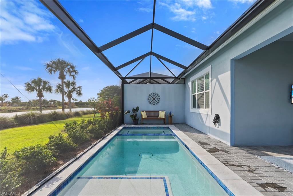 5716 Highbourne Drive Naples, FL 34113 - Photo 26 of 36 a view of a backyard with a patio