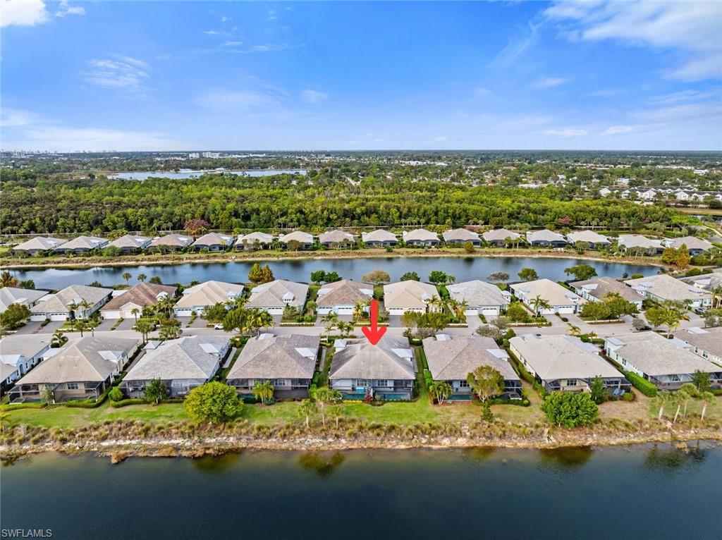 5716 Highbourne Drive Naples, FL 34113 - Photo 28 of 36 an aerial view of residential houses with outdoor space