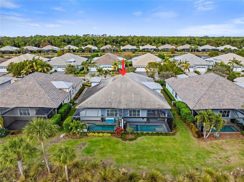 5716 Highbourne Drive Naples, FL 34113 - Photo 29 of 36 an aerial view of houses with yard