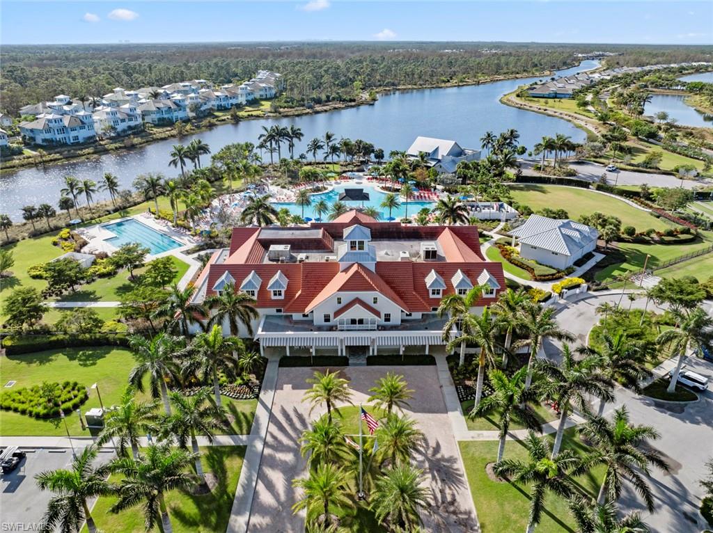 5716 Highbourne Drive Naples, FL 34113 - Photo 31 of 36 an aerial view of a house with a lake view