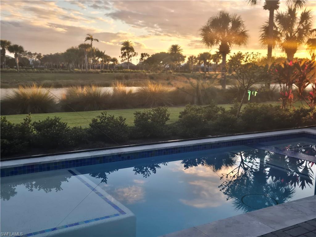 5716 Highbourne Drive Naples, FL 34113 - Photo 36 of 36 a view of a lake from a balcony