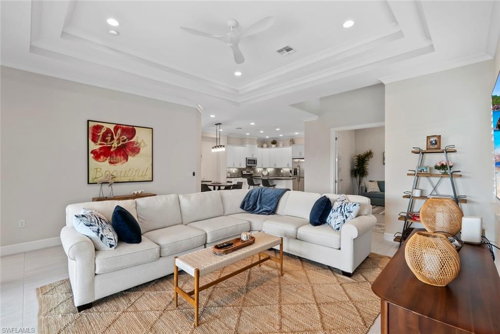 5716 Highbourne Drive Naples, FL 34113 - Photo 10 of 36 a living room with furniture and a couch