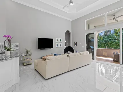a dining room with furniture a window and a chandelier