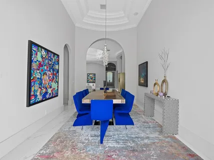 a view of living room filled with furniture and a fireplace