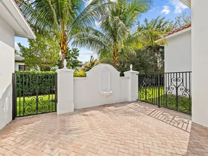 a view of a backyard with swimming pool