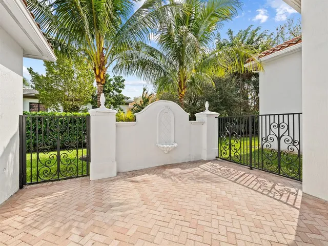 a view of a backyard with swimming pool