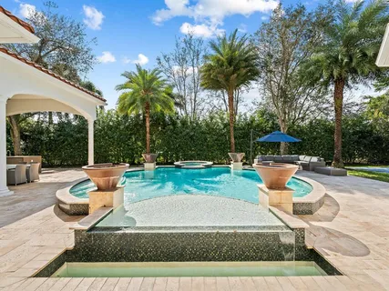 a view of a swimming pool with a patio