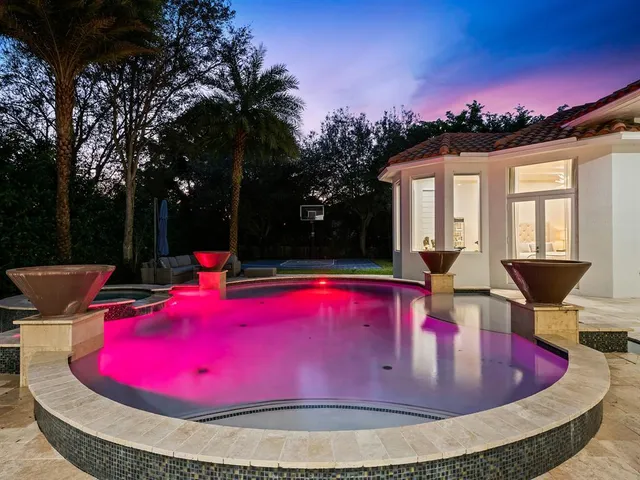 a kitchen with a table and chairs in it