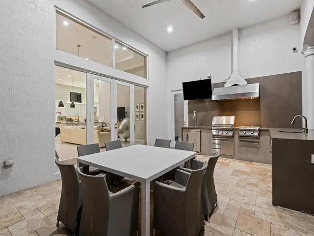 a bedroom with a bed dresser and a window