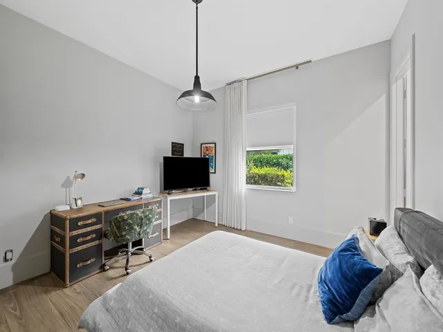 a front view of a house with yard and green space