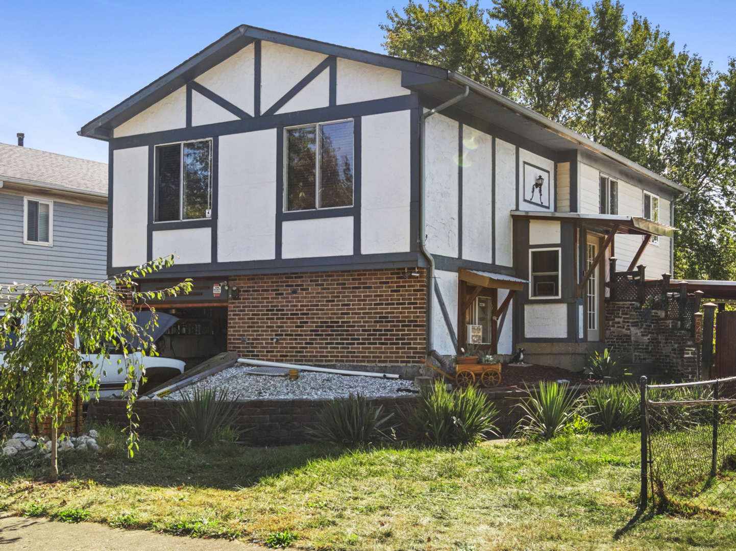 a front view of a house with garden