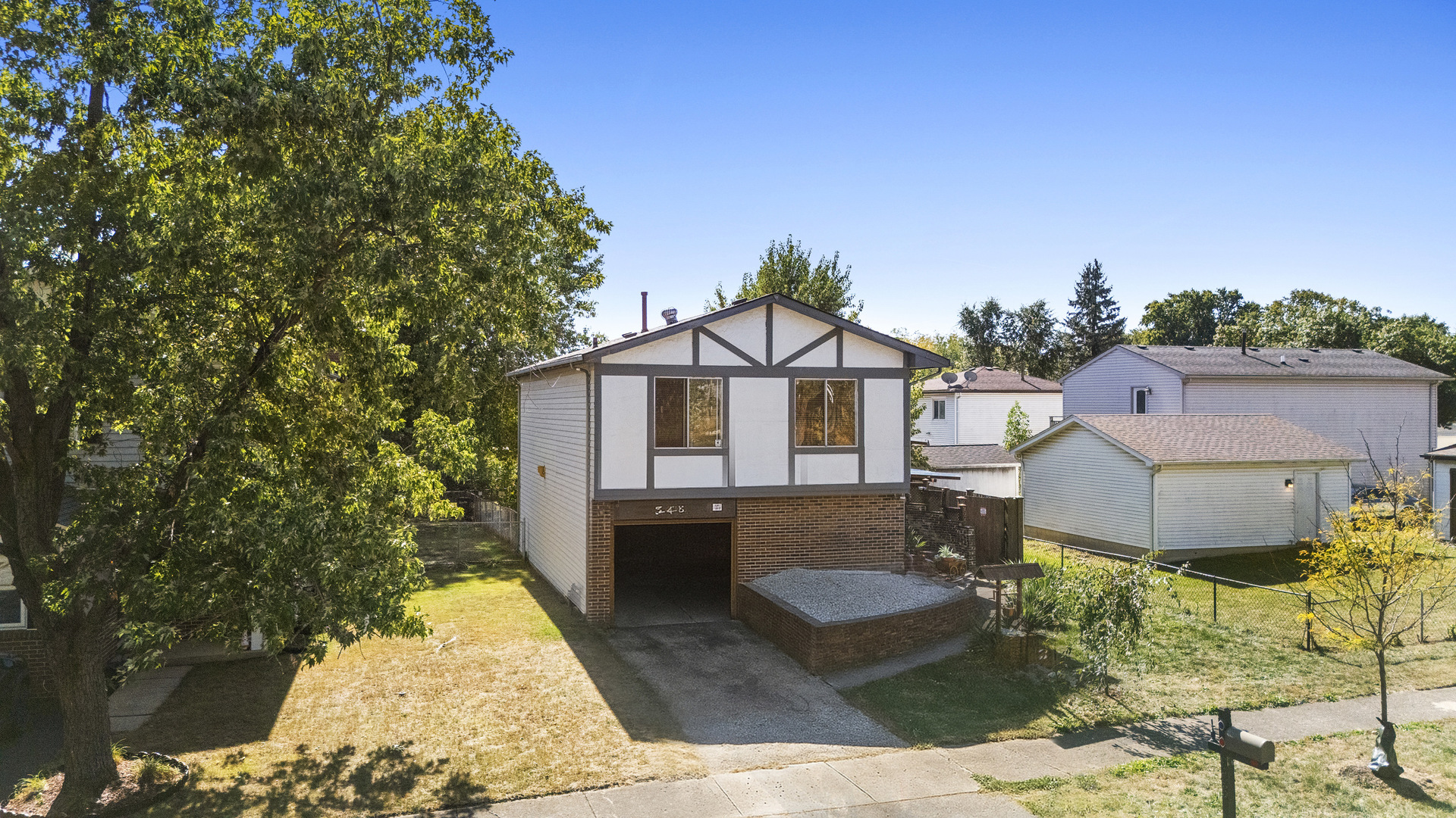 545 Old Stone Road Bolingbrook, IL 60440 - Photo 19 of 28 a front view of a house with garden