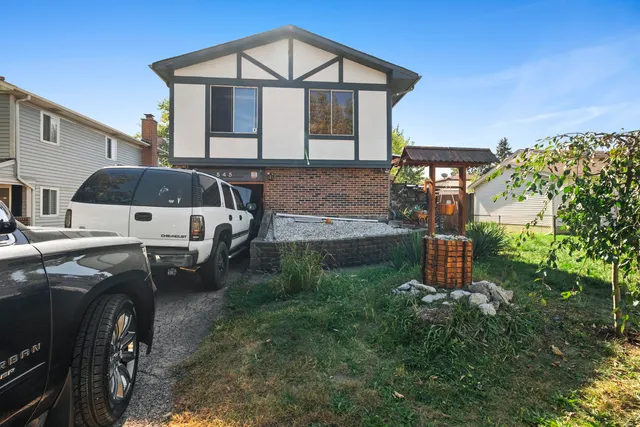 a yellow house in middle of the forest