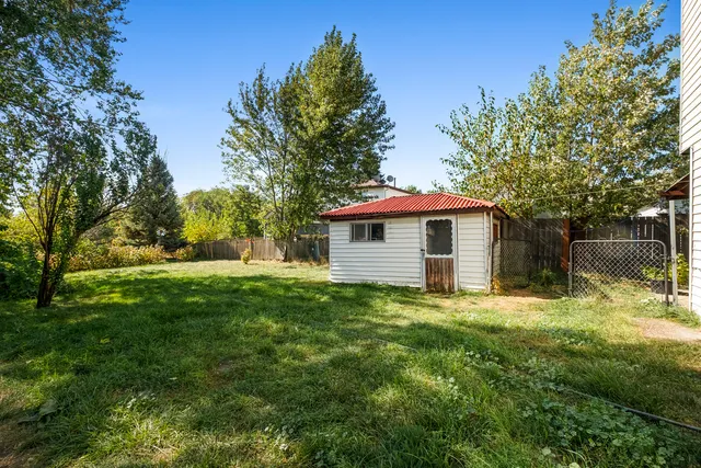 a front view of house with yard and outdoor seating