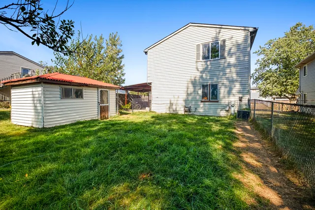 a view of a yard with a tree