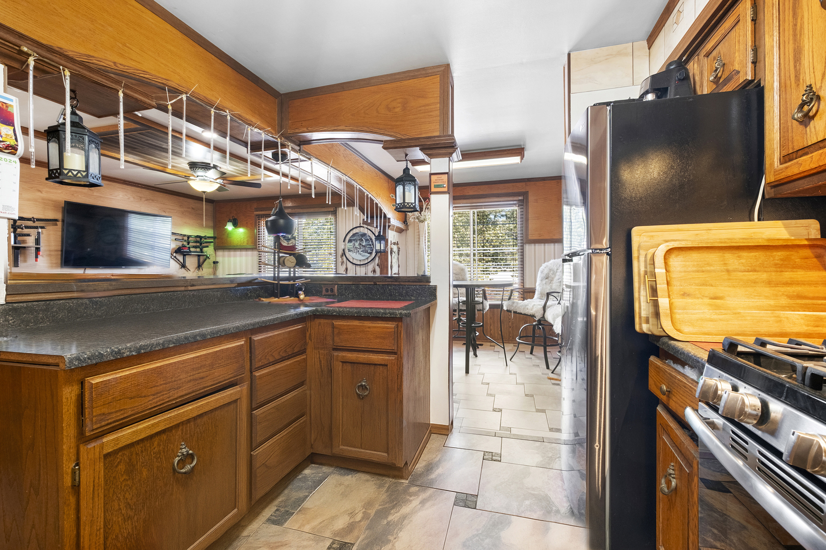 545 Old Stone Road Bolingbrook, IL 60440 - Photo 4 of 28 a kitchen with stainless steel appliances a sink and a microwave
