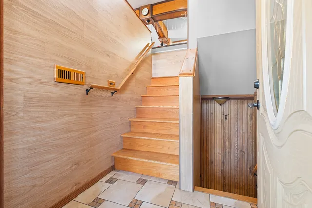 a view of entryway with stairs