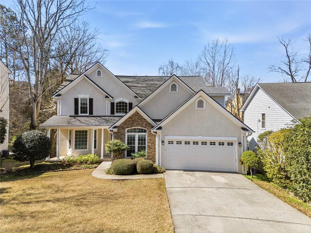 3325 River Summit Trail Duluth, GA 30097 - Photo 1 of 1 a front view of a house with a yard and garage