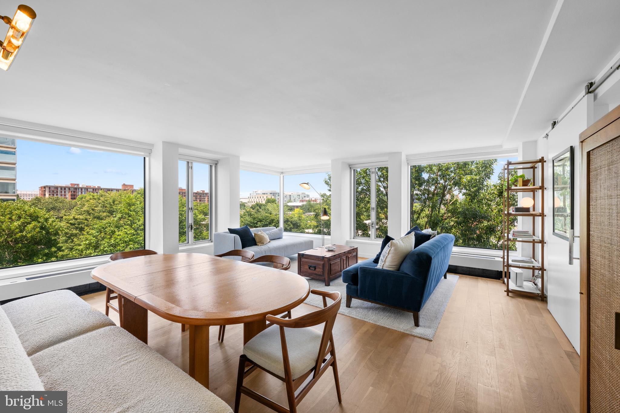 1101 3rd Street Southwest, Unit 315 Washington, DC 20024 - Photo 1 of 38 a living room with furniture and a large window