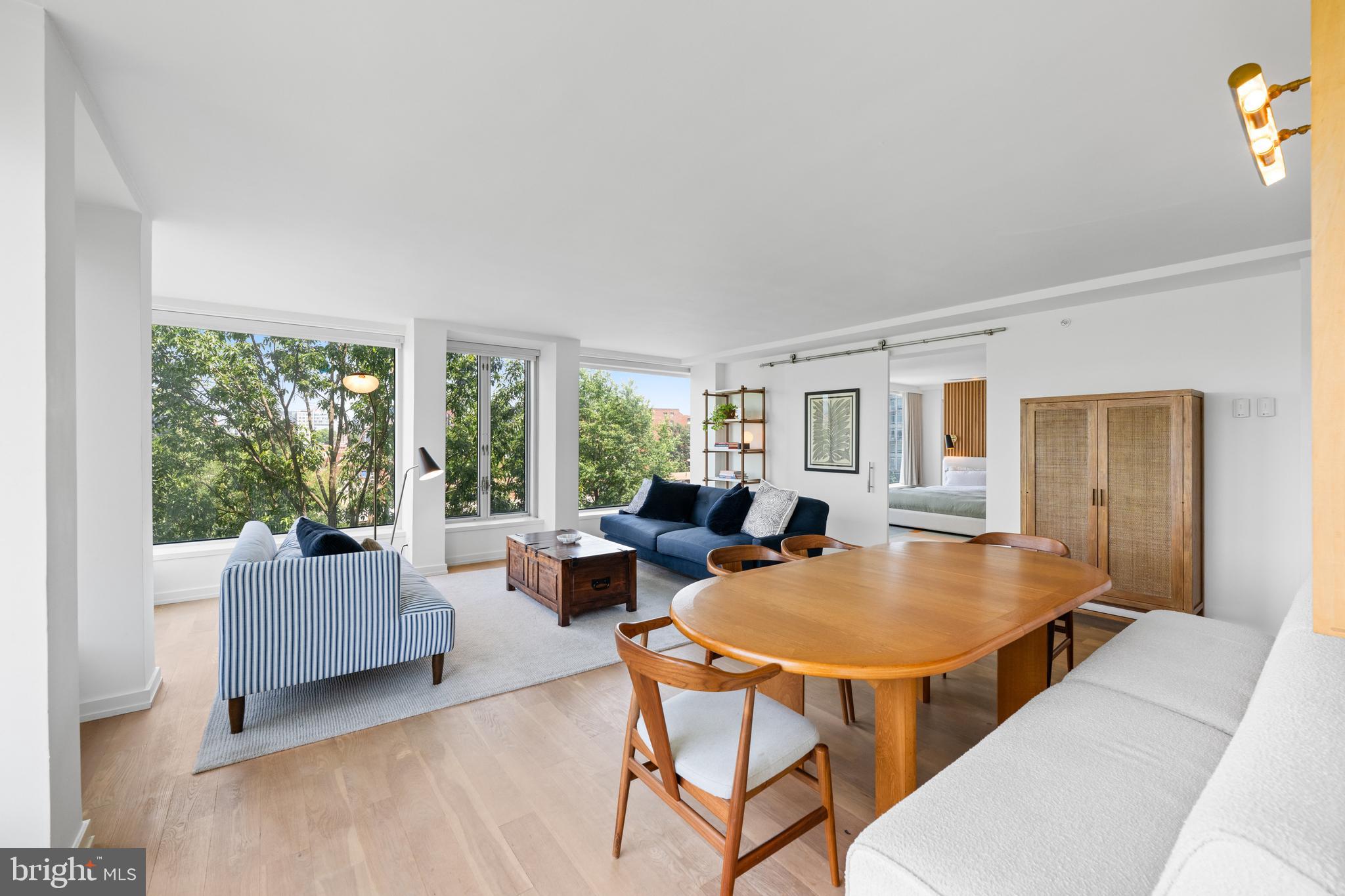 1101 3rd Street Southwest, Unit 315 Washington, DC 20024 - Photo 12 of 38 a living room with furniture and a window
