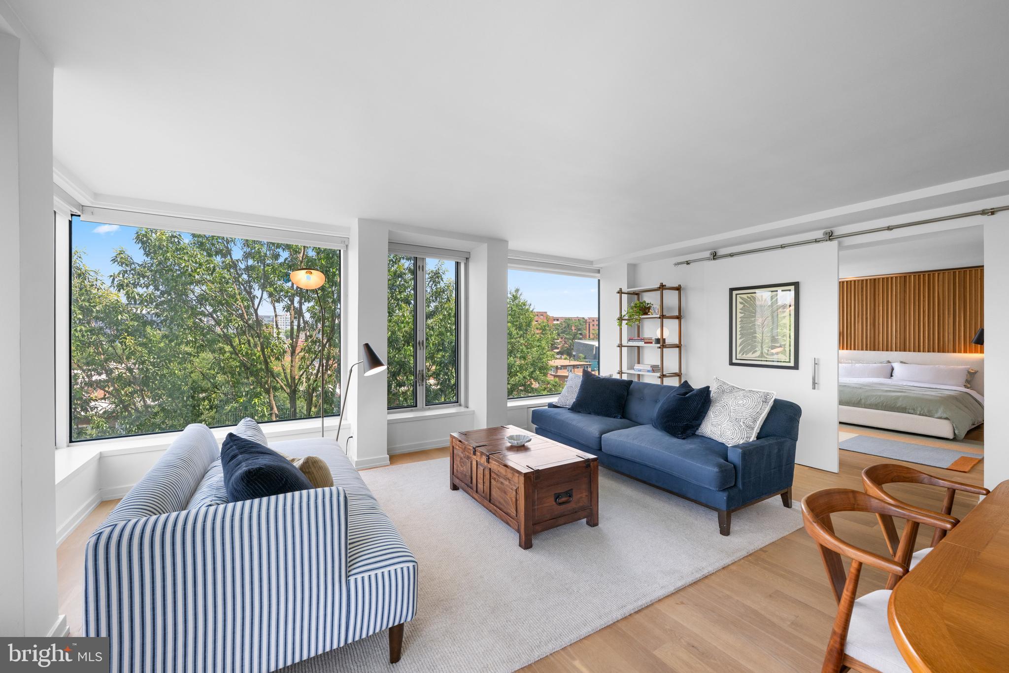 1101 3rd Street Southwest, Unit 315 Washington, DC 20024 - Photo 13 of 38 a living room with furniture and a large window