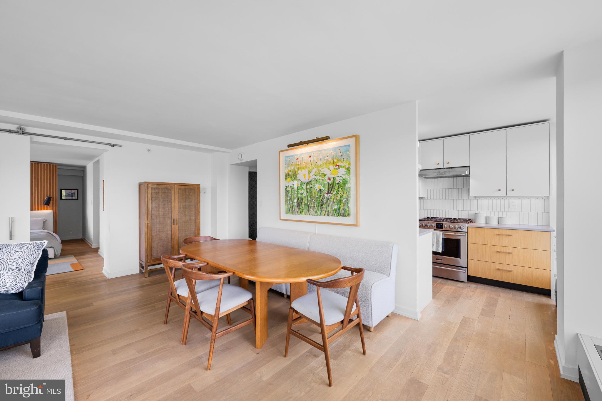 1101 3rd Street Southwest, Unit 315 Washington, DC 20024 - Photo 14 of 38 a kitchen with a table and chairs in it