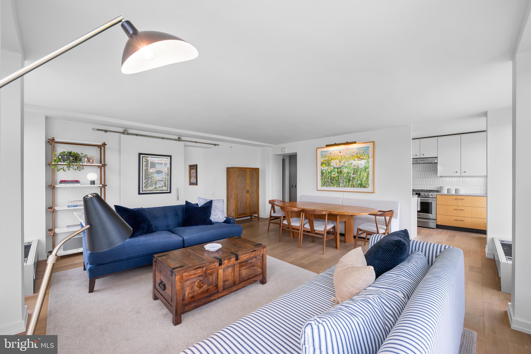 1101 3rd Street Southwest, Unit 315 Washington, DC 20024 - Photo 15 of 38 a living room with furniture and a window