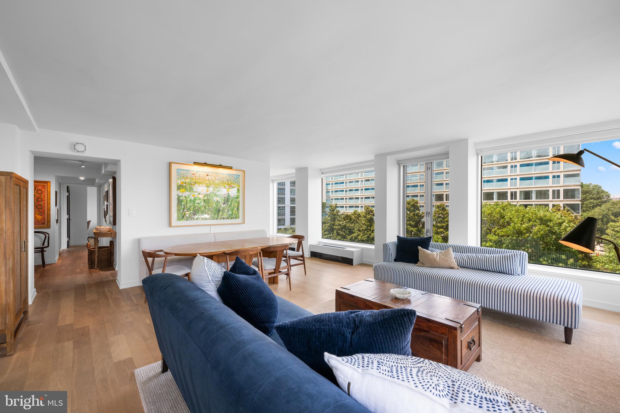 1101 3rd Street Southwest, Unit 315 Washington, DC 20024 - Photo 16 of 38 a living room with furniture and a window