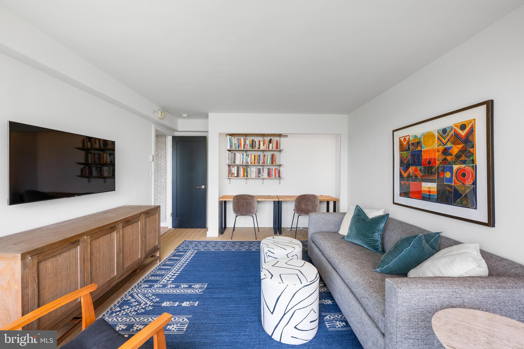1101 3rd Street Southwest, Unit 315 Washington, DC 20024 - Photo 24 of 38 a living room with furniture and a flat screen tv