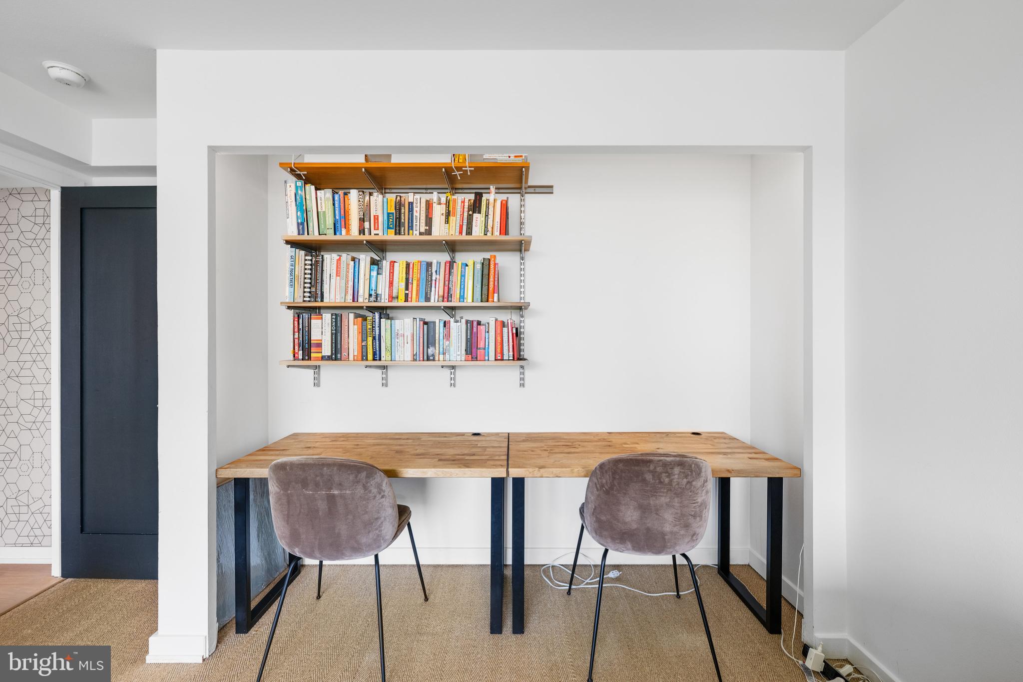 1101 3rd Street Southwest, Unit 315 Washington, DC 20024 - Photo 25 of 38 a workspace with furniture and a book shelf