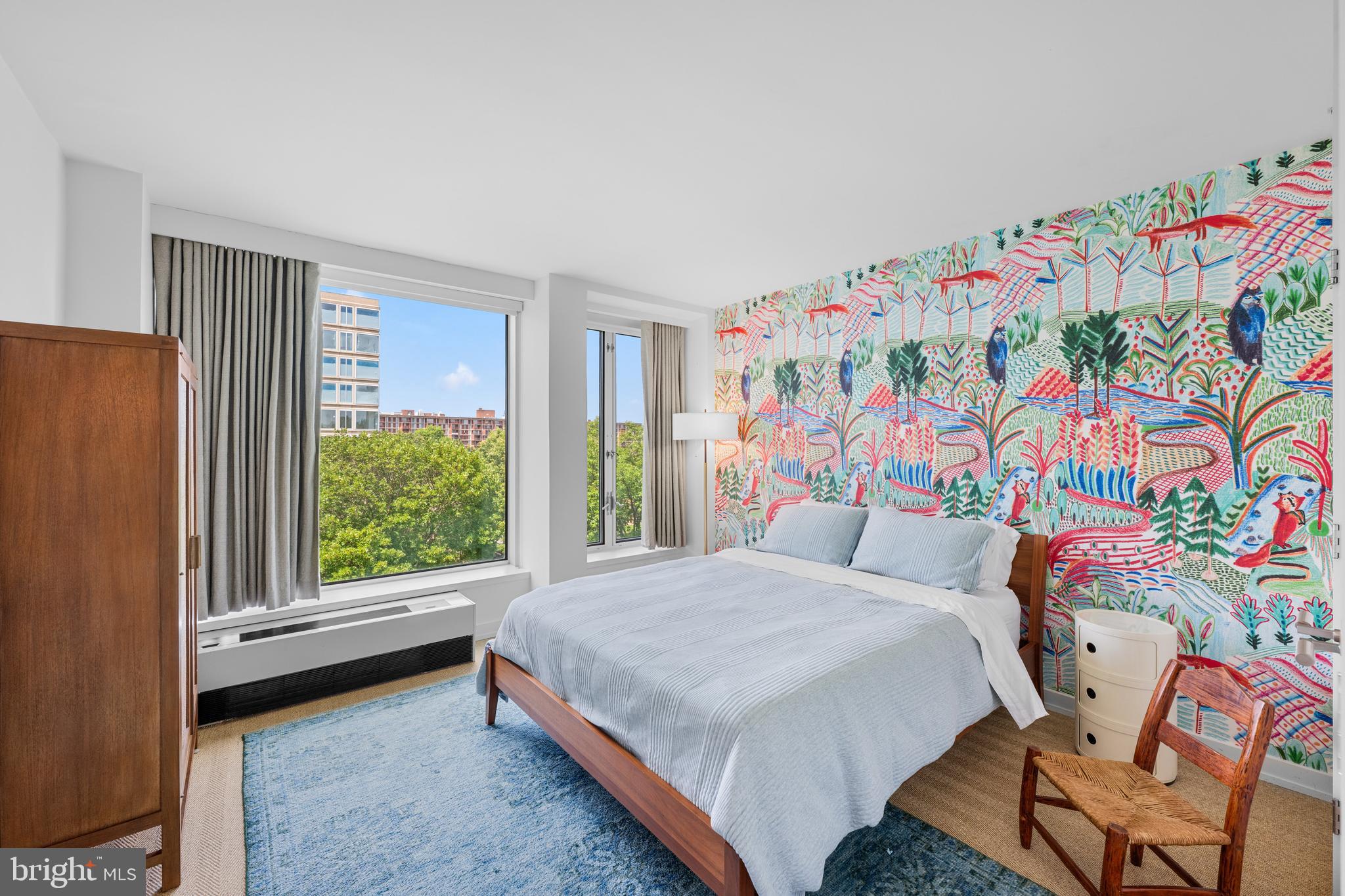 1101 3rd Street Southwest, Unit 315 Washington, DC 20024 - Photo 26 of 38 a bedroom with a bed and a window