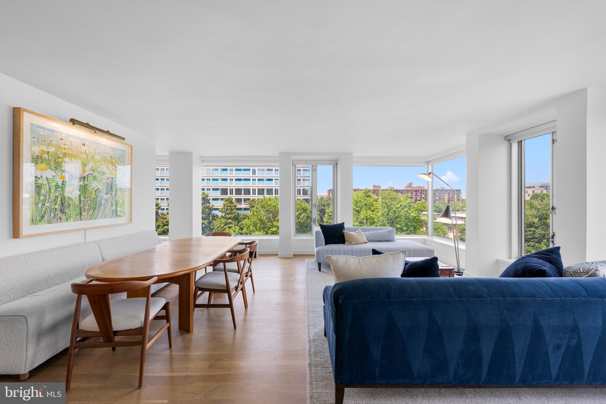 1101 3rd Street Southwest, Unit 315 Washington, DC 20024 - Photo 10 of 38 a living room with furniture and a large window