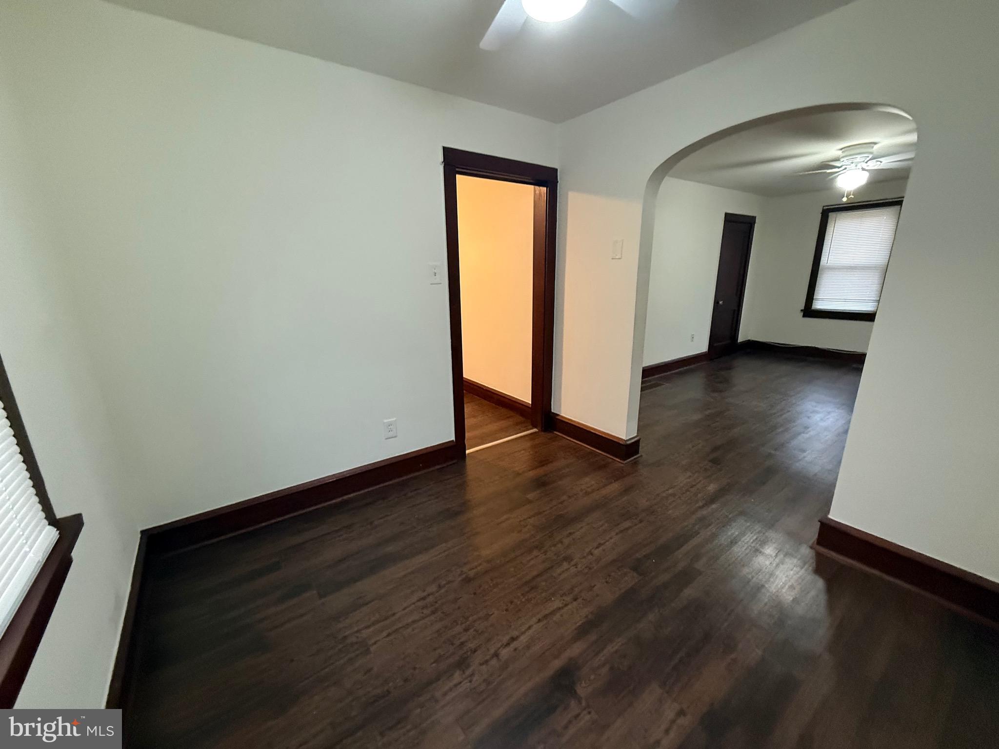 266 Apt B2 Shell Road Carneys Point, NJ 08069 - Photo 7 of 14 an empty room with wooden floor and mirror