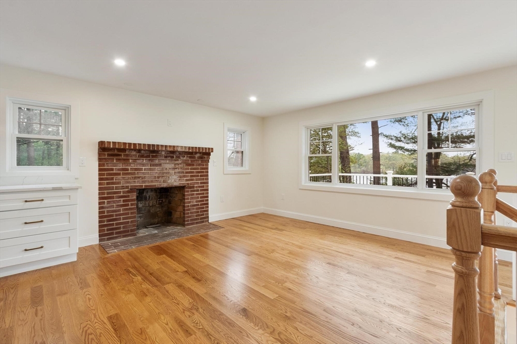 50 Pine Grove Road Lunenburg, MA 01462 - Photo 11 of 42 a view of an empty room with a window and fireplace
