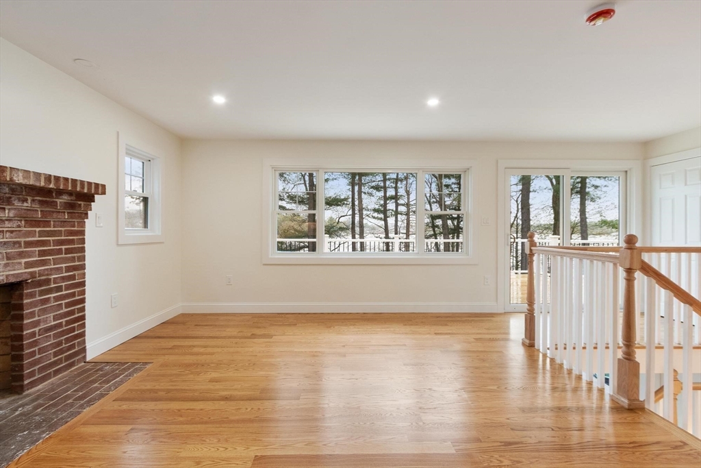 50 Pine Grove Road Lunenburg, MA 01462 - Photo 13 of 42 a view of an empty room with wooden floor and a window