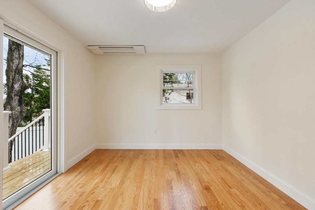 50 Pine Grove Road Lunenburg, MA 01462 - Photo 18 of 42 an empty room with a window and wooden floor