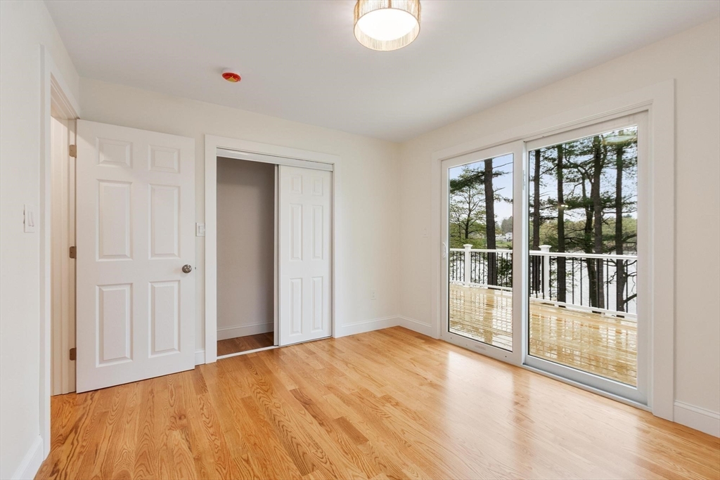 50 Pine Grove Road Lunenburg, MA 01462 - Photo 19 of 42 a view of empty room with wooden floor and fan