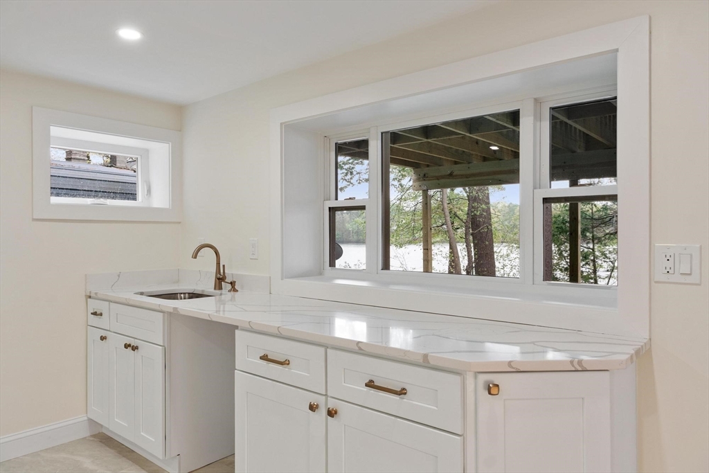 50 Pine Grove Road Lunenburg, MA 01462 - Photo 27 of 42 a utility room with a sink and large window