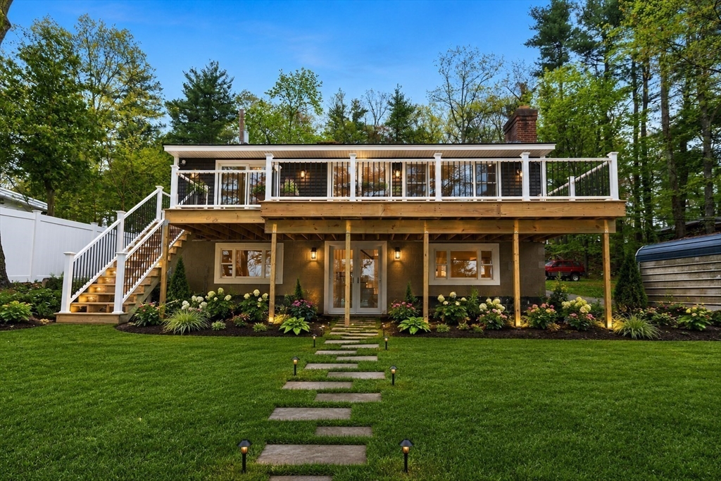 50 Pine Grove Road Lunenburg, MA 01462 - Photo 42 of 42 a front view of a house with a yard table and chairs